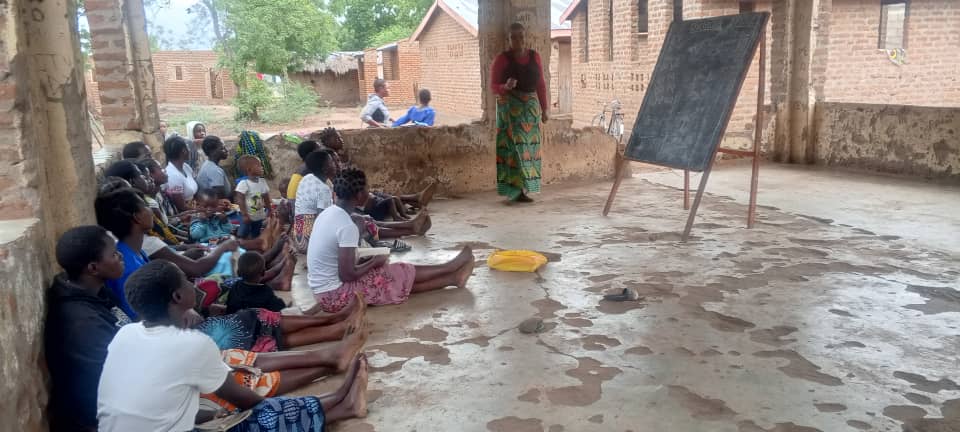 A man teaching young students